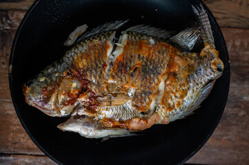 Close-up of fried mojarra in a pan