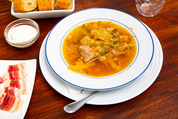 National dish of Russian cuisine is cabbage soup, cooked in thick broth and on the basis of sauerkraut with meat