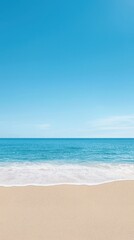 Fototapeta premium Serene Beach View with Gentle Waves and Clear Blue Sky Above