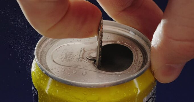 To successfully open a carbonated beverage can, one typically uses a convenient pull tab mechanism