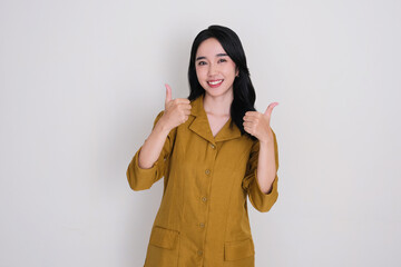 Indonesian female civil servant smiling happy and give two thumbs up