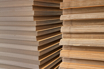 Paper factory process texture carton industry brown cardbox. container cardboard for packing, Pile of corrugated cardboard sheets and ready to use. Paper card box manufacture, raw materials industry.