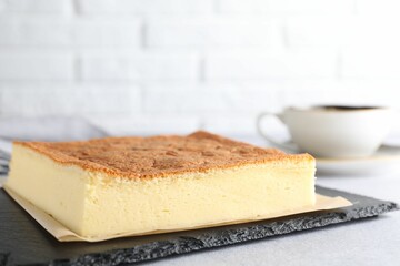 Tasty Japanese Castella sponge cake served on light table, closeup. Space for text