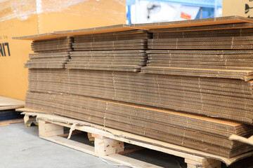 Paper factory process texture carton industry brown cardbox. container cardboard for packing, Pile of corrugated cardboard sheets and ready to use. Paper card box manufacture, raw materials industry.