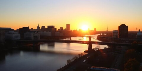 Obraz premium Golden hour sunset casts long shadows over Boston skyline, Longfellow Bridge spanning calm Charles River, urban, calm water