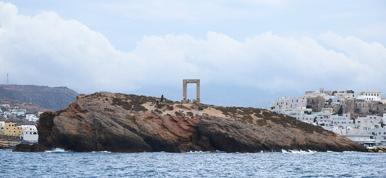 View of The Island of Naxos in Greece with the ruins of the Portara great door on the islet of palatia