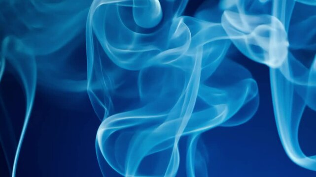 Abstract plumes of blue smoke swirl, creating a mesmerizing visual effect.