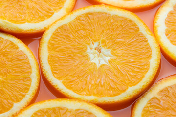 Orange slice on orange juice background