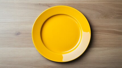 Bright yellow plate sits on a neutral colored wooden surface