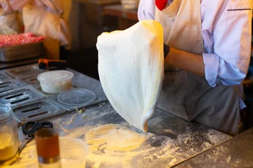 Fototapete Making process of pizza stella napoletana, a traditional star-shaped pizza from Naples or Napoli, Italy. © Ralfa Padantya