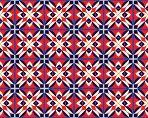 Fototapeta premium This seamless pattern displays a vibrant arrangement of geometric shapes in shades of red, cream, and navy blue, creating a bold visual effect