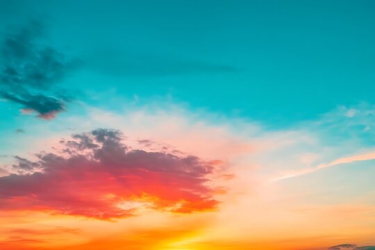 Stunning sunset sky with fiery orange pink and purple streaks wispy clouds glowing softly evoking tranquil - Powered by Adobe