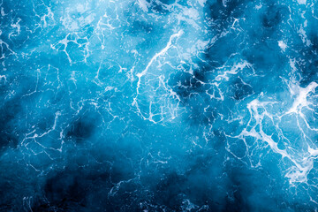 Sea surface background. Aerial view of captivating foamy water. Can be used in covers, packaging, posters, textures, cards, art, and design projects. Elegant nature background image.