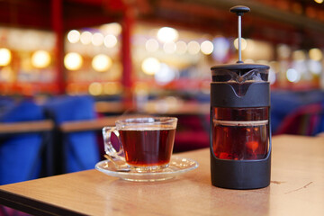 Coffee and tea displayed in a cozy cafe setting