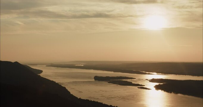 Volga river reflecting golden sunset light near Samara, Russia