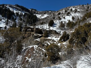 view looking at wind caves with snow on mountain, popular hiking destination in Logan Canyon 