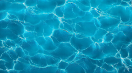 Crystal clear turquoise water surface reflecting sunlight, creating beautiful ripples