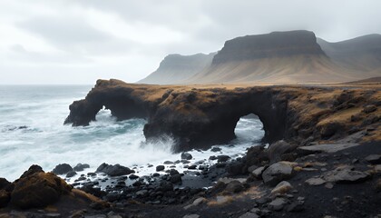 Obraz premium Ocean Waves Crashing Against a Dramatic Coastal Arch