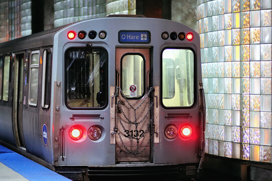 A CTA rapid transit train at Chicago's O'Hare International Airport terminal. The Chicago Transit Authority blue line ends at the busy airport and provides riders with a link to the Loop.
