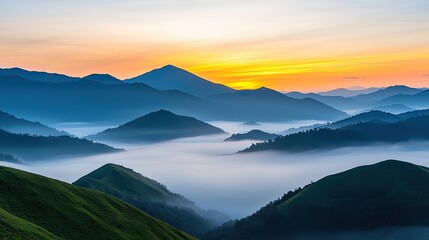 Obraz premium Mountain range landscapes concept. Breathtaking sunrise over misty mountains, showcasing nature's serene beauty.