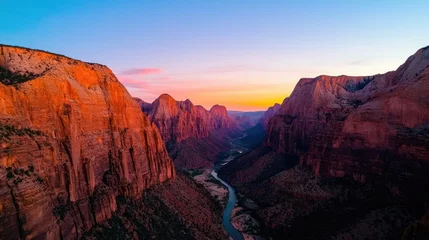 Gordijnen Mountain range landscapes concept. Glowing red and orange cliffs under a twilight sky, a deep canyon carved by a winding river, dramatic yet harmonious, ultrarealistic, cinematic 4K wideangle shot © Tin