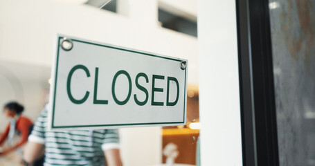 Closed sign, coffee shop and front door with closeup, window and information for customer at restaurant. Board, notice and public signage on glass for diner, cafeteria and store with hospitality