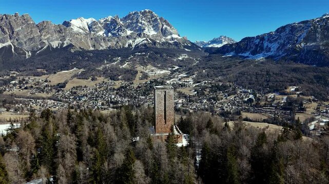 drone fly above Cortina d&rsquo;Ampezzo firt world war monument alpine valley, dolomite resort town