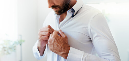 Shirt, hands and man getting ready in home in morning for dressing with fashion for wardrobe. Style, preparing and male person with button for business clothes for work with formal closet in house.