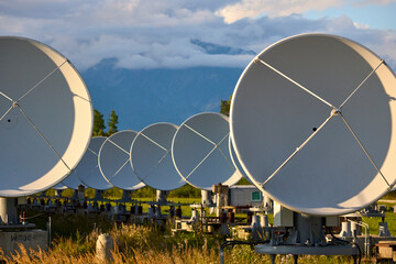Plates of the solar radio telescope on the background of mountains