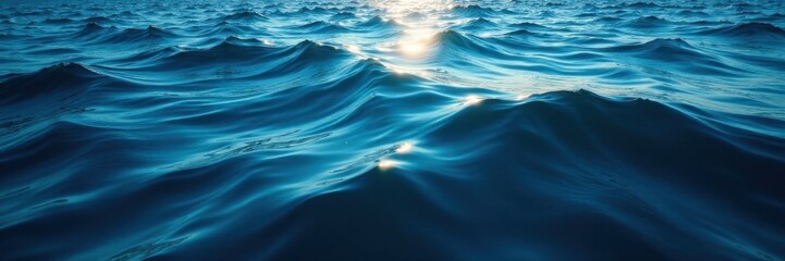 Naklejka premium Deep ocean surface with dark blue waters reflecting sunlight filtering through waves , water, ocean