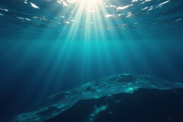 Fototapeta premium Deep ocean surface with dark blue hue, sunlight filtering down through waves, light penetration, aquatic scene
