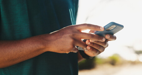 Outdoor, online and hands with smartphone, fitness and planning for workout on app, closeup and nature. Browsing, athlete and tracking performance on website, tech and person with mobile for exercise