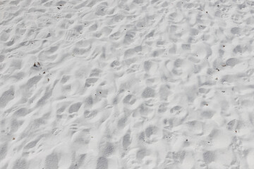 Fine white sand that glistens and reflects the sunlight.