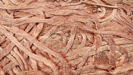 Artistically tangled copper wires creating a chaotic yet intriguing textural pattern with varying shades.