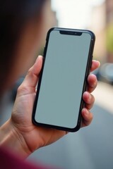 Close-up of female hand holding cell phone with blank screen, empty, hand