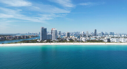 Naklejka premium Miami beach cityscape. Miami summer aerial view. Miami Beach shoreline. South Beach Miami aerial view. Blue ocean in Florida skyline. Miamis cityscape. Ocean coast.