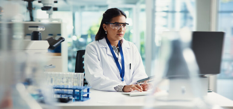 Research, medical and woman in lab, laptop and internet with connection, cure development and cancer treatment. Person, researcher or scientist in workplace, pc or website info with report or results