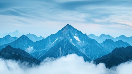 Obraz premium Mountain range landscapes concept. A breathtaking view of majestic mountains shrouded in mist and clouds.