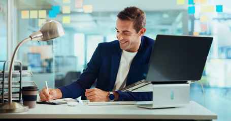 Business, writing and man in office, laptop and smile with positive feedback, ideas for article and...