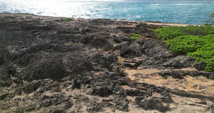 Drone footage of the Laie Point State Wayside on a sunny day in Laie town, Hawaii, United States