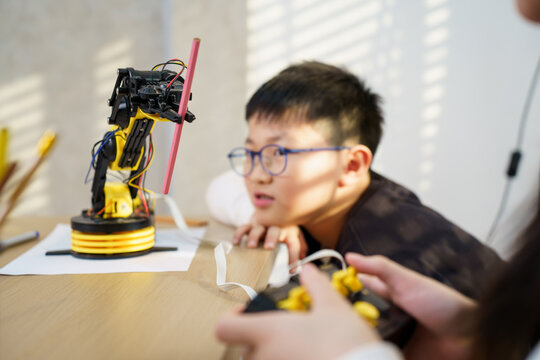 Asian boy and girl are learning with STEM toys, STEM is Sciences, Technology, Engineering, and Mathematics.