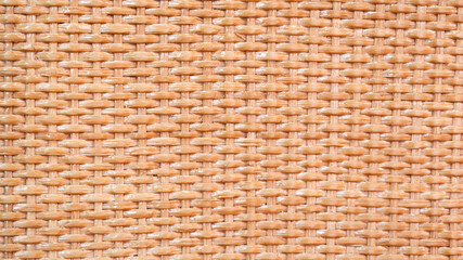 brown background with wavy rattan texture. The background of a wicker basket.