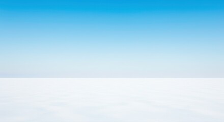 Obraz premium Serene Winter Landscape Expansive White Snow Under a Clear Blue Sky