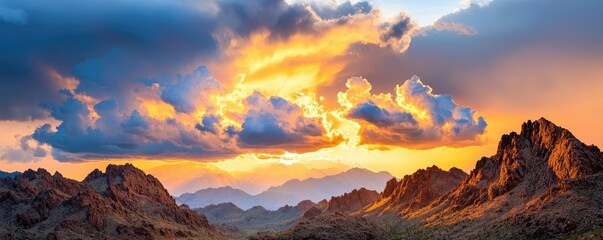 Naklejka premium Mountain range landscapes idea. A stunning sunset over majestic mountains with colorful clouds and golden light.