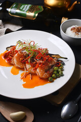 a plate of fried shrimp with vegetables and rice