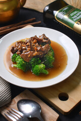 a plate of beef stew with potatoes and vegetables