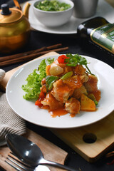 a plate of chicken breast with vegetables