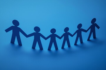 Paper cutout figures holding hands on blue background.