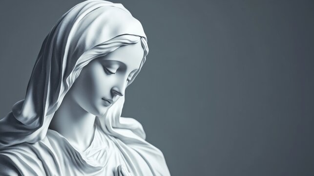 Elegant marble statue of Virgin Mary with serene expression and folded hands