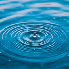 Teal Water Droplet Impacting Calm Surface